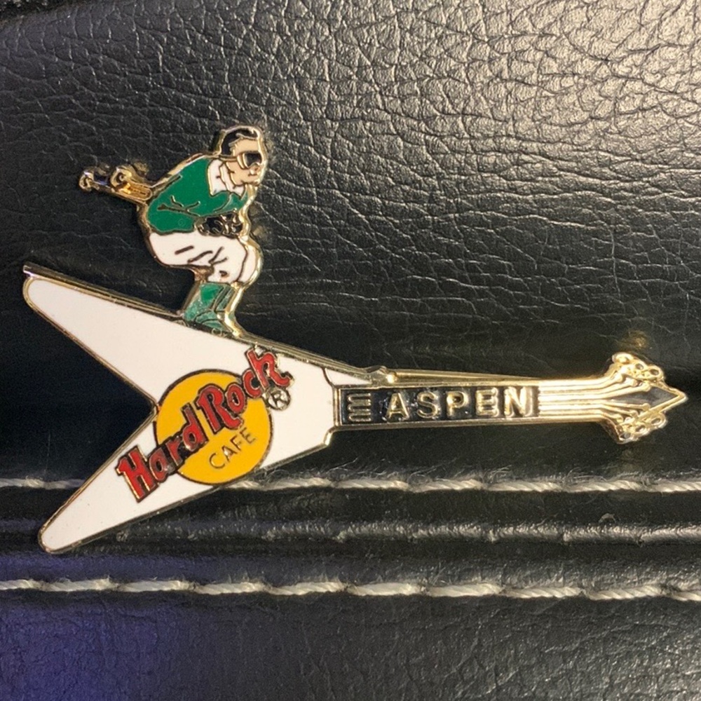 Hard Rock Cafe Pin Aspen Flying V White w/Green & White Skier Guitar